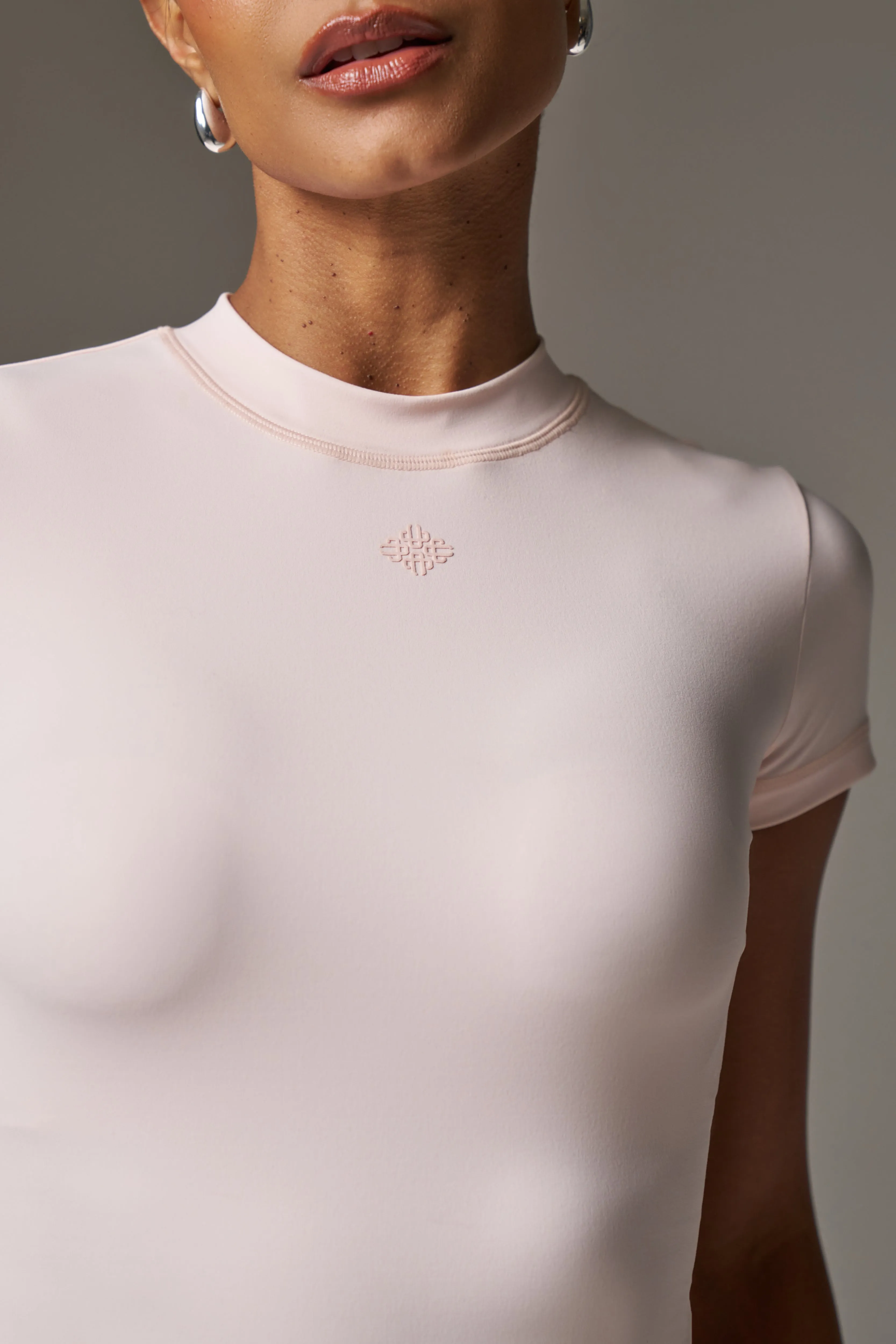 SCULPTING STRETCH EMBLEM BABY TEE - PINK