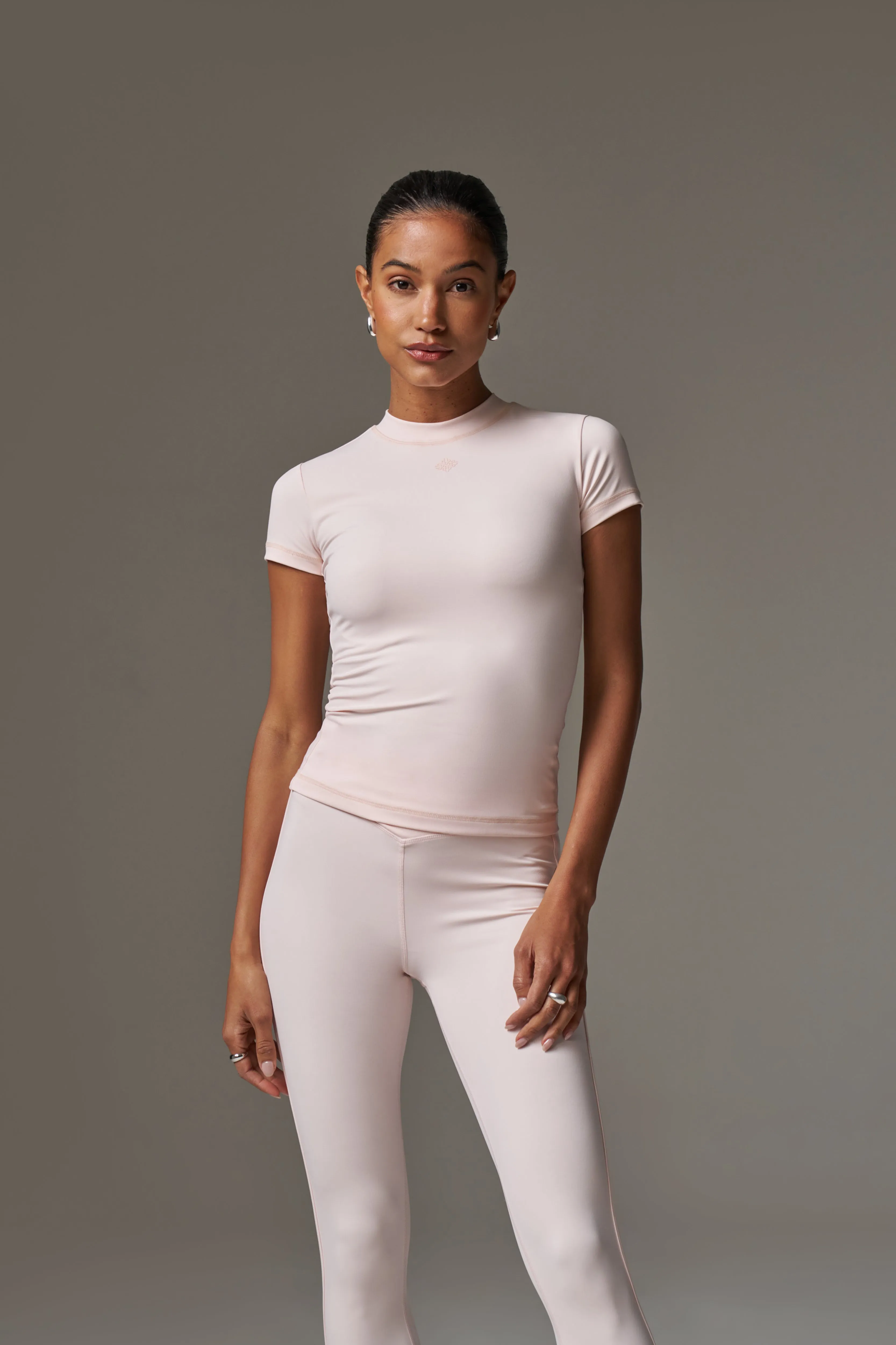 SCULPTING STRETCH EMBLEM BABY TEE - PINK